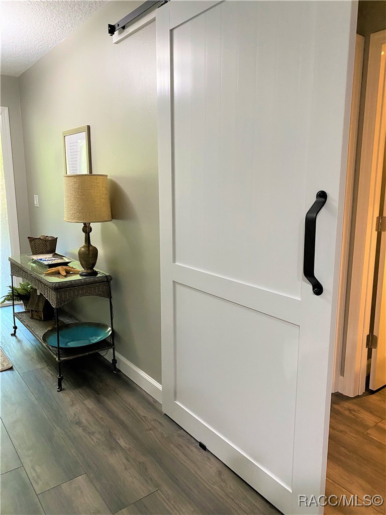 This Sliding Barn Door Provides Privacy for the Queen Master Suite with full bath.
