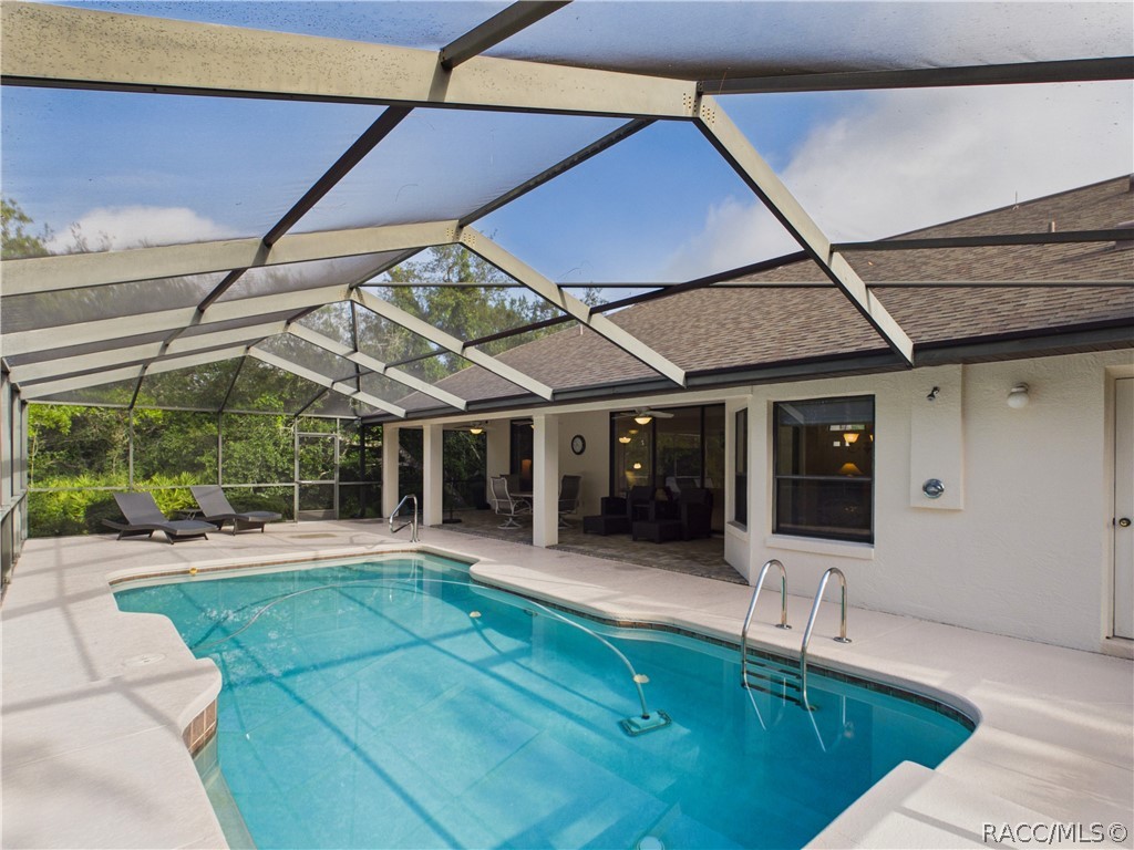 POOL VIEW TO THE RIGHT SHOWIN THE LANAI
