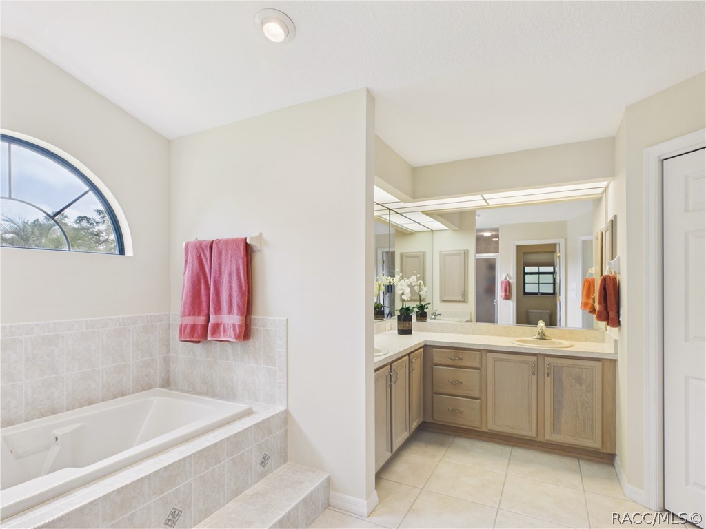 ANOTHER VIEW OF THE BATHTUB AND VANITY