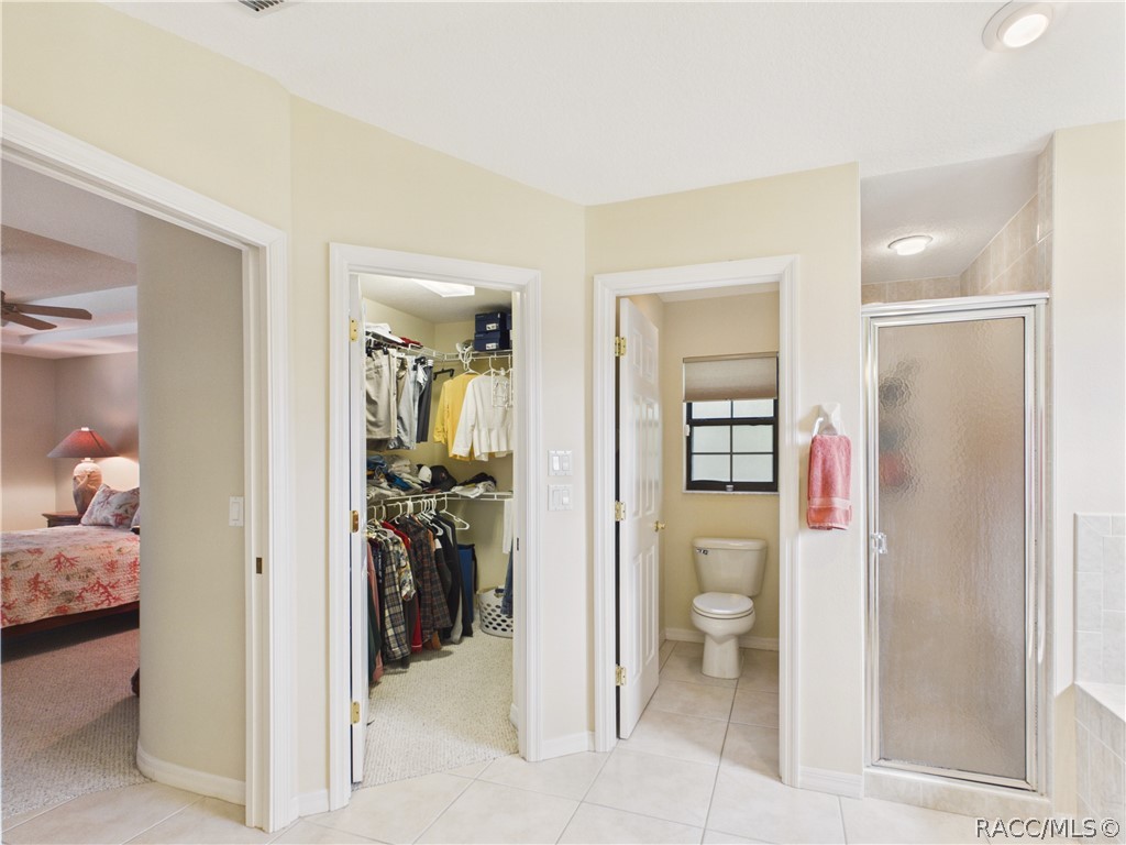 WALK IN CLOSET, SEPARATE TOILET AND GLASS DOOR SHOWER