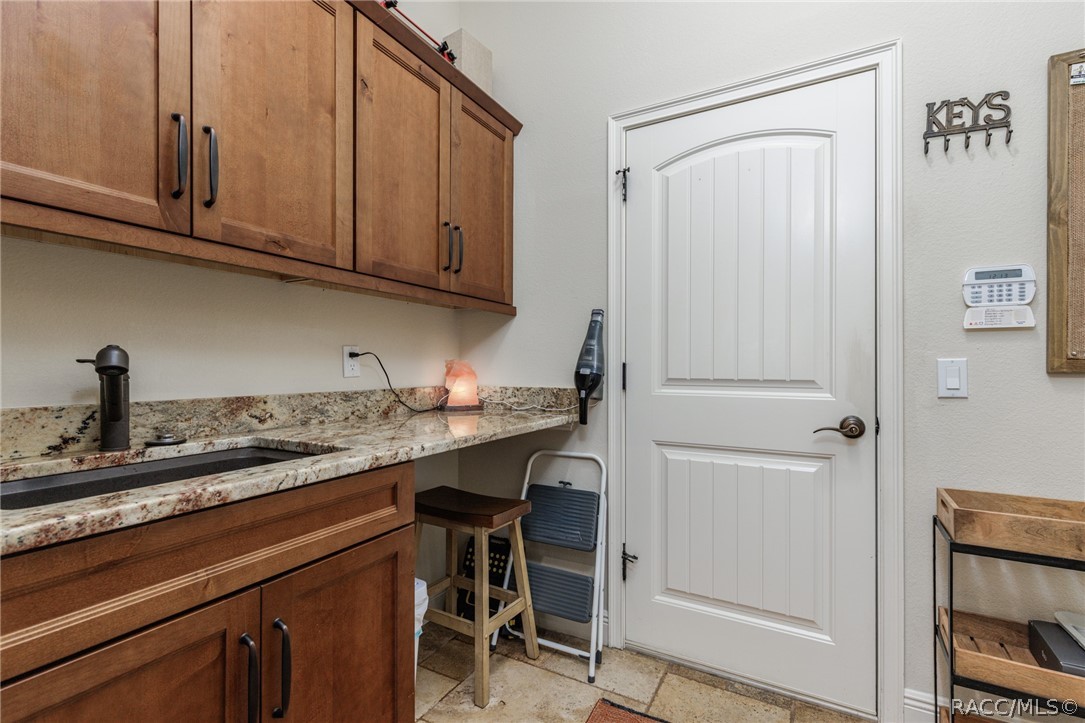 Laundry room with sink & lots of storage