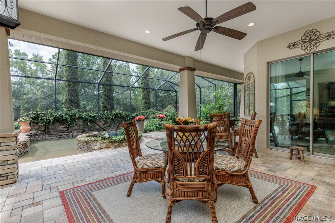 Covered lanai w/ caged pool off livingroom