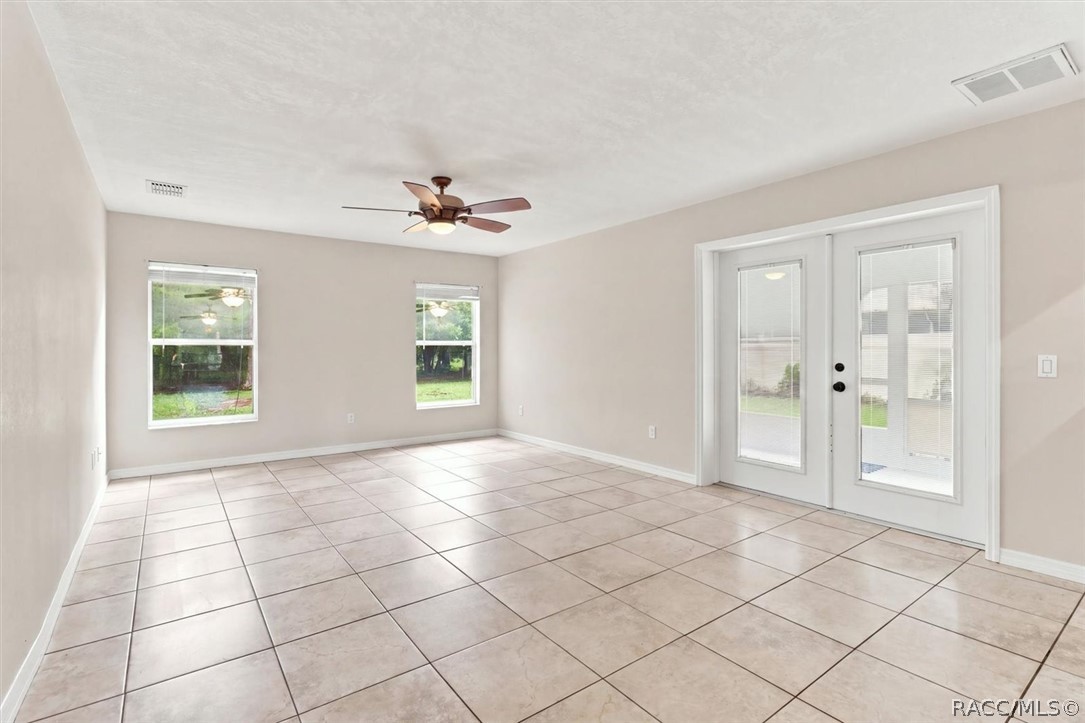 Family Room with french doors to screened-in porch