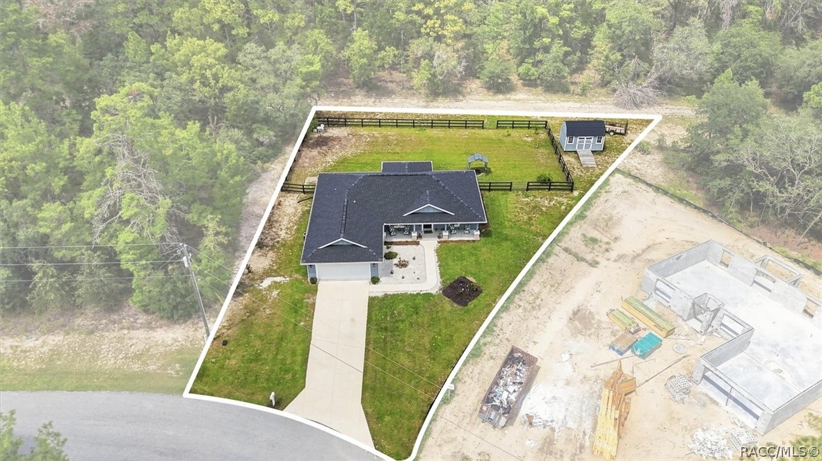 Aerial view of property.  Note front and rear access gates in fencing.