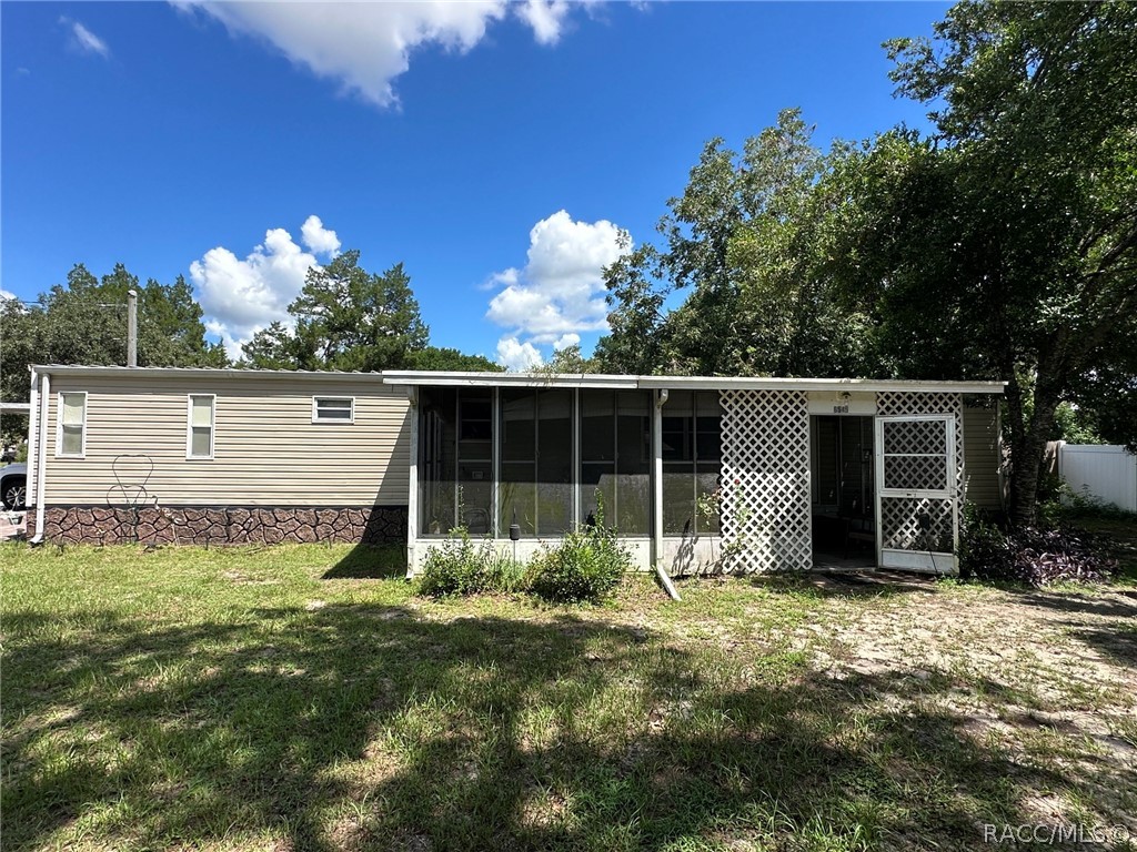 Front of home with screened porch