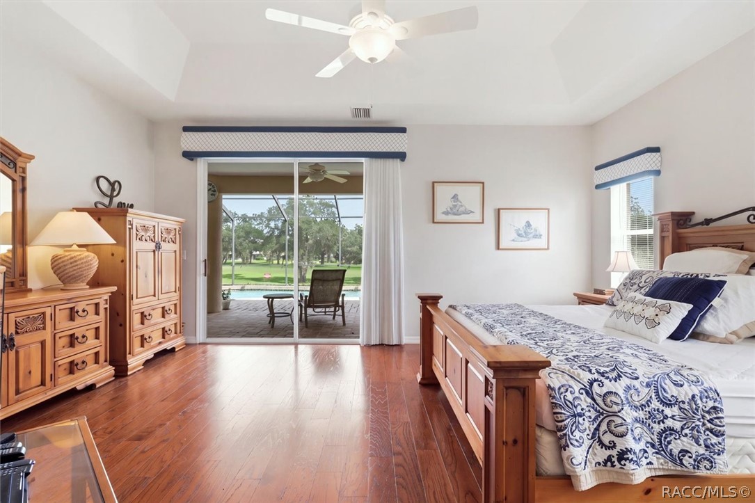 Primary bedroom with sliders and great view