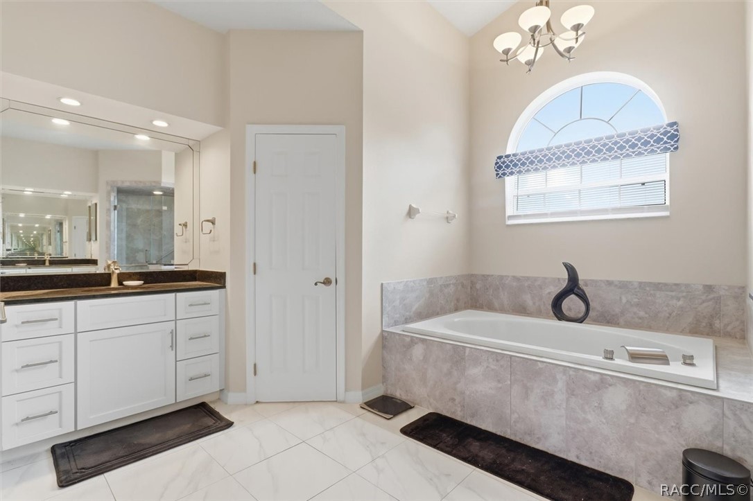 Primary ensuite has soaking tub and water closet