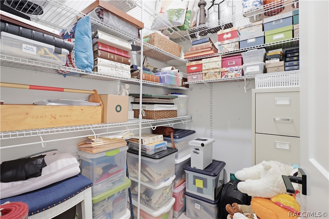 WALK-IN STORAGE ROOM
Storage is definitely not an afterthought! This dedicated walk-in storage room features extensive wraparound wire shelving w/ multiple levels of organized space for household supplies, keepsakes, seasonal dcor, files, crafts & more.