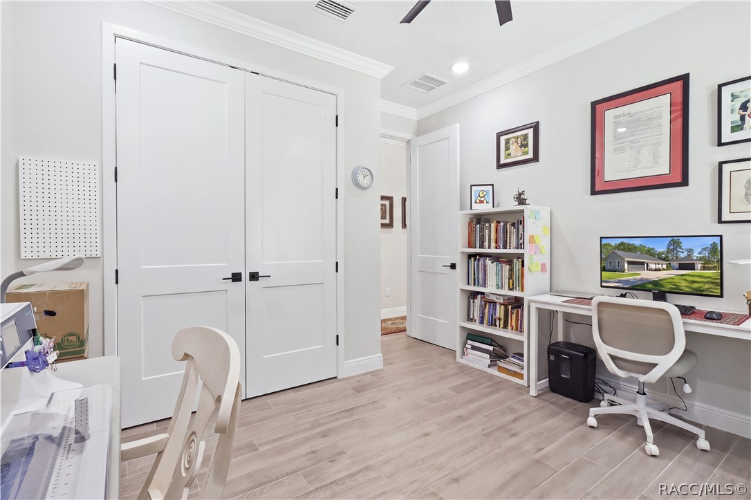 FLEX ROOM / OFFICE / Bedroom 2  Another angle showcases the room's double-door closet, generous workspace & clean contemporary finishes. This flexible space can easily adapt as an office, craft room, den or additional bedroom depending on your needs.