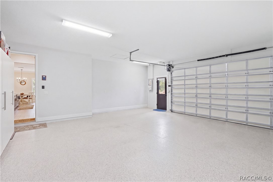 ATTACHED OVERSIZED GARAGE  Clean & spacious attached garage features a finished floor, bright overhead lighting, automatic garage door opener & convenient exterior access door. Direct access into the home makes everyday unloading easy.