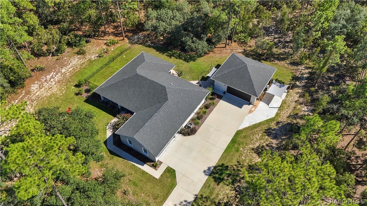 AERIAL NEIGHBORHOOD VIEW
Elevated aerial perspective showcases the propertys spacious wooded setting & generous setback from the road. Surrounding homes sit on substantial parcels, creating an open residential feel complemented by a mature tree canopy.