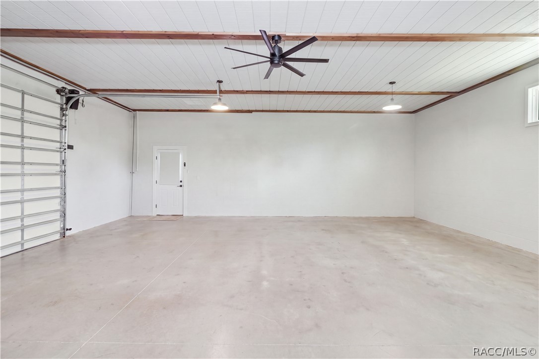 DETACHED 30x30 GARAGE  CLEAN, BRIGHT & FINISHED
An exceptionally clean attached garage featuring a finished epoxy floor, crisp white walls, bright overhead lighting & two windows dressed  The wide-open floor space provides plenty of room for parking, storage or a work area or in-law suite