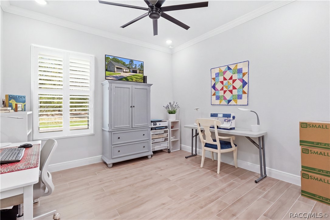 FLEX ROOM / HOME OFFICE / Bedroom 2 Versatile bonus room offers plenty of space for a home office, craft room, hobby room or additional guest space. Plantation shutters, crown molding, recessed lighting, modern ceiling fan & porcelain tile flooring continue the home's cohesive finishes.