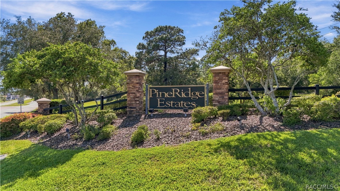 PINE RIDGE ESTATES  ENTRANCE FROM CR 491
Entrance to Pine Ridge Estates from CR 491, featuring the communitys distinctive monument signage, brick columns, black rail fencing & beautifully maintained landscapingan attractive gateway into the community.