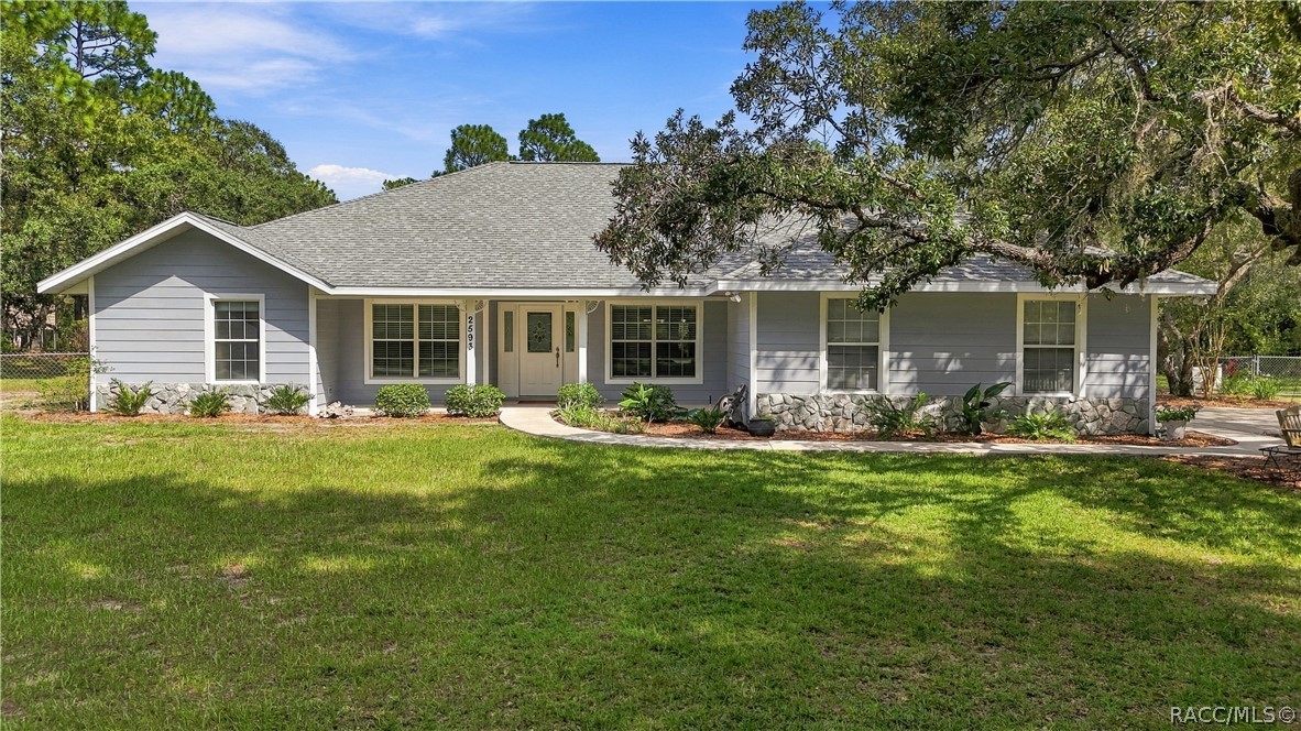 WELCOME HOME!!! CLASSIC CURB APPEAL  Attractive front elevation framed by mature landscaping and sitting on 1.25 fully fenced yard.