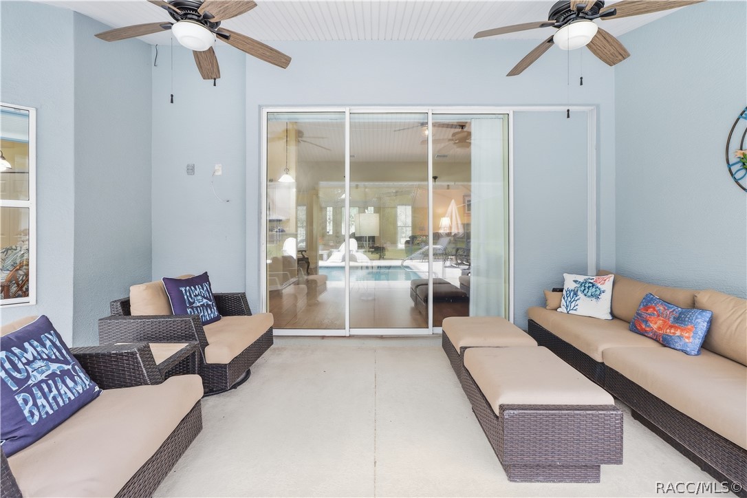 Covered Lanai  Additional view highlighting the generous covered entertaining space and direct access to the home and pool area.
