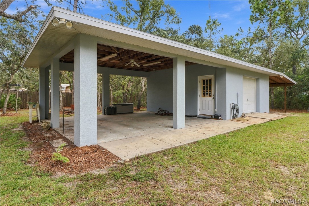 DETACHED 20x20 GARAGE + 2 COVERED CARPORTS + POLE BARN Versatile detached garage/workshop with an oversized covered area for additional parking, equipment or outdoor projects. BRING YOUR TOYS!