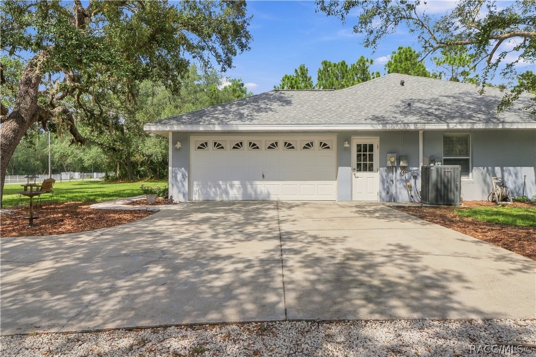 Attached Garage  BRAND NEW ROOF 2026  Attached 2-car garage with generous driveway space, side entry.