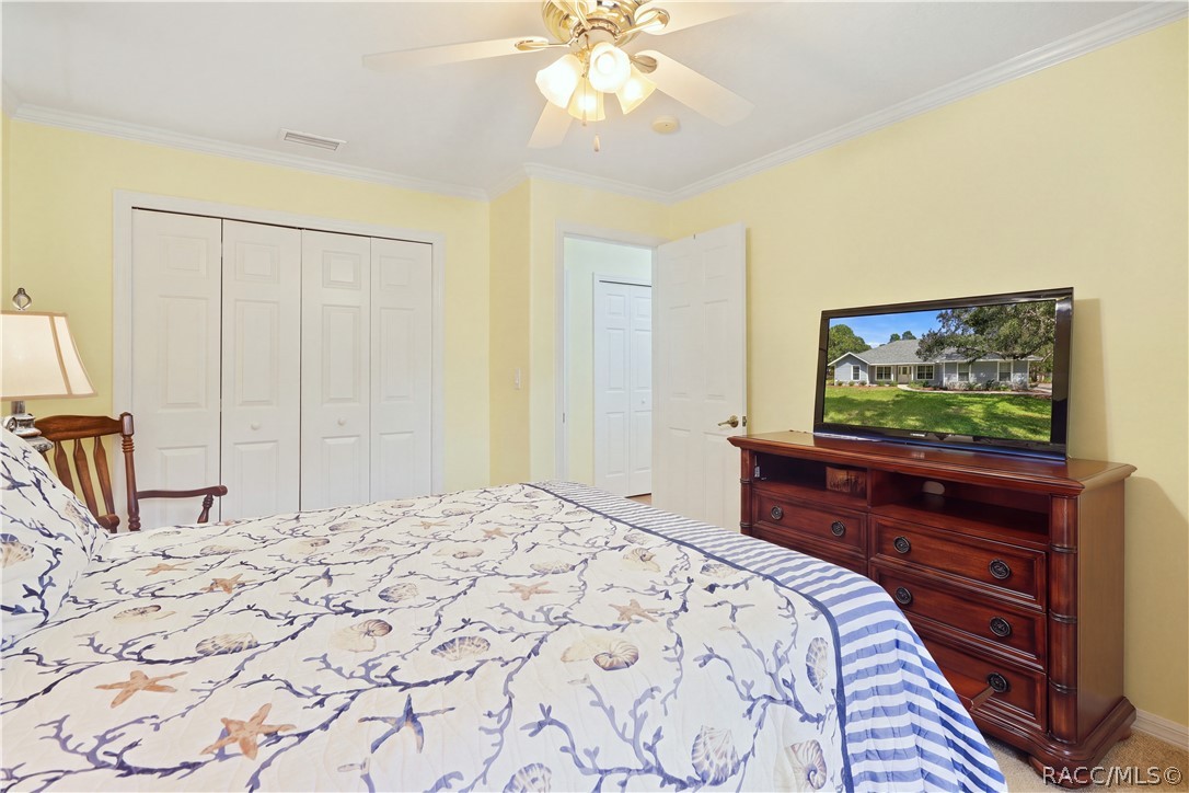 Guest Bedroom  Alternate view showing ample closet space and room for additional furnishings.