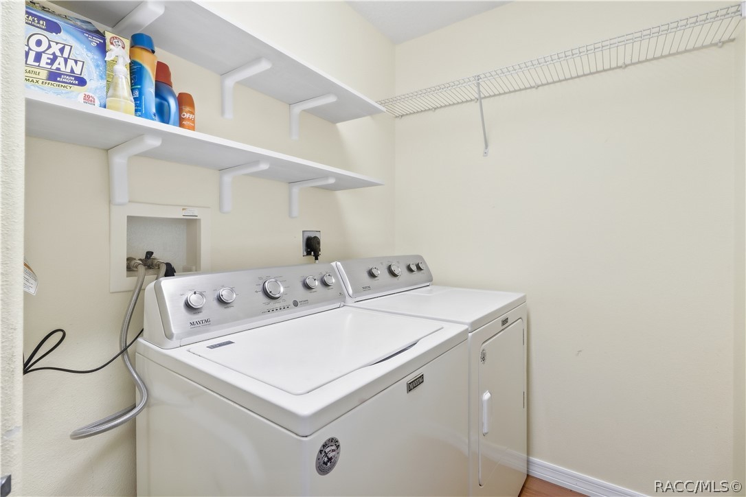 Indoor Laundry Room  Dedicated laundry area with washer and dryer, shelving and additional storage space.