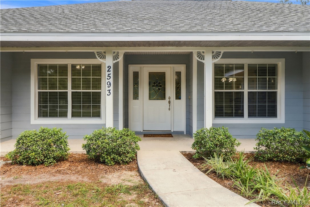 Covered Front Entry  Welcoming covered front porch with landscaped walkway, decorative glass front door & sidelights.