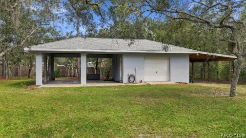 Detached 20 x20 Garage/Outbuilding/Workshop PLUS 2 Carports w/a Concrete Slab & a POLE BARN  Separate detached garage/outbuilding offering additional covered space, storage & plenty of possibilities.
