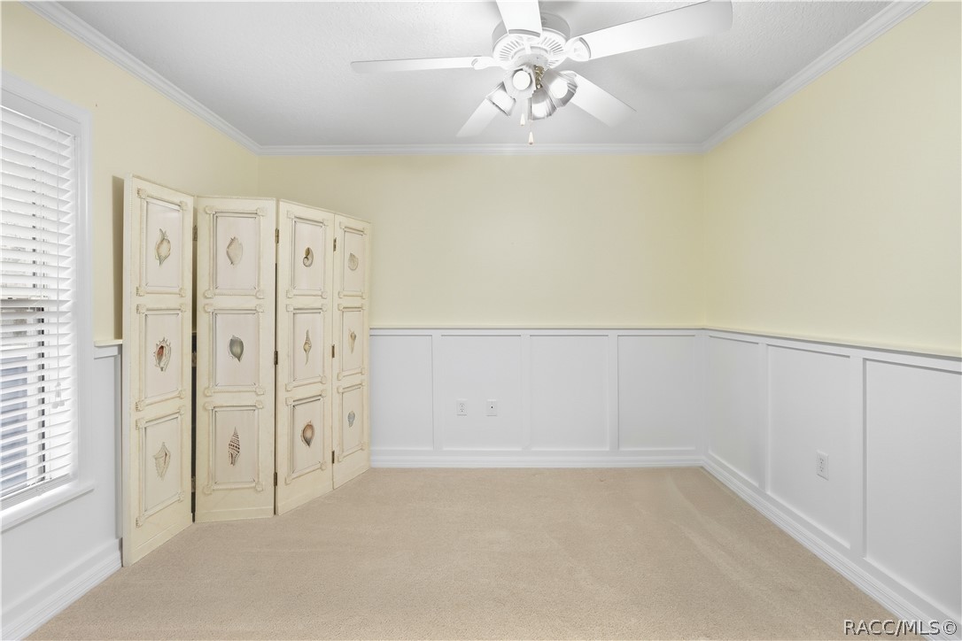 Additional Guest Bedroom  Alternate view highlighting the rooms size, natural light and decorative wall detail/wainscoating.