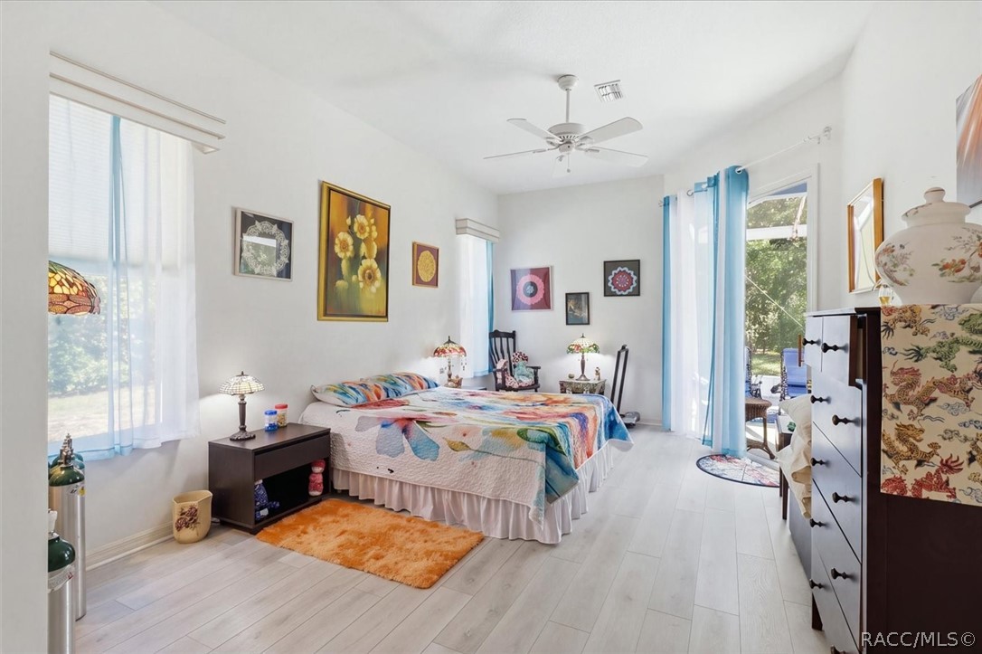 Primary bedroom with sliders to lanai