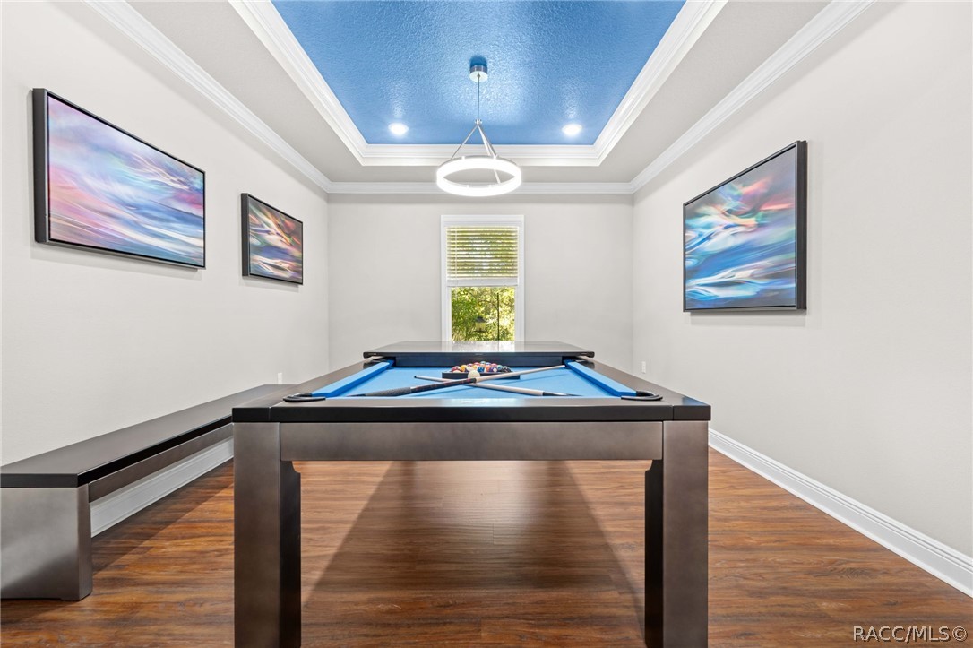 Flex Room is currently used as a Game Room with a Pool table that converts in a dining table with bench seating