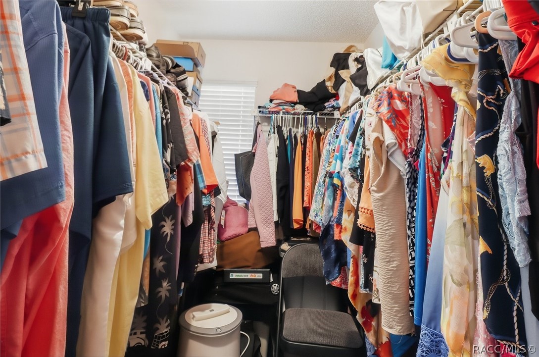 large walk in closet in primary bedroom