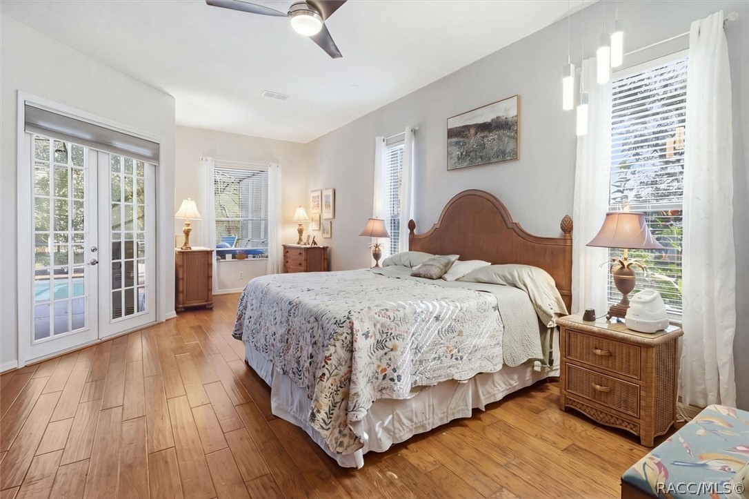Primary Bedroom with lanai access and fireplace