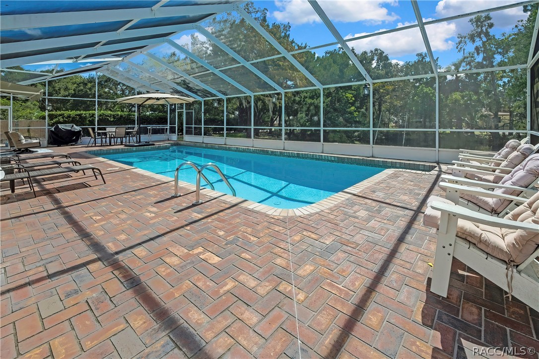 Brick paver patio surrounding the pool.