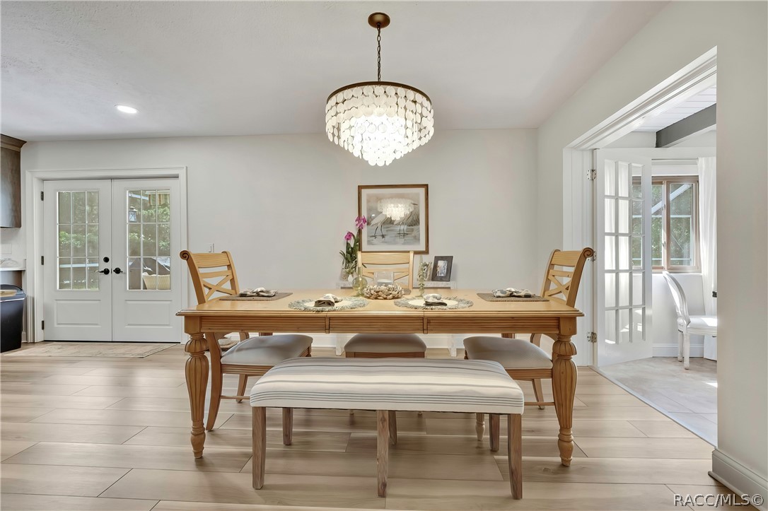 Dining area with pendant light and bench seating.