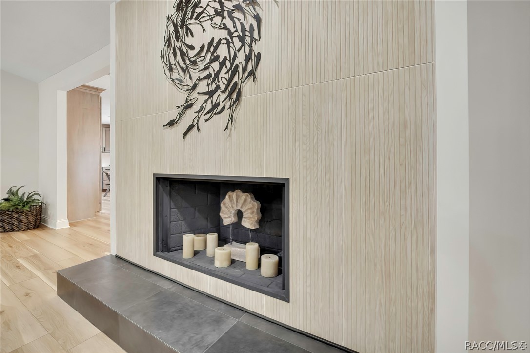 Wood fireplace with raised hearth.