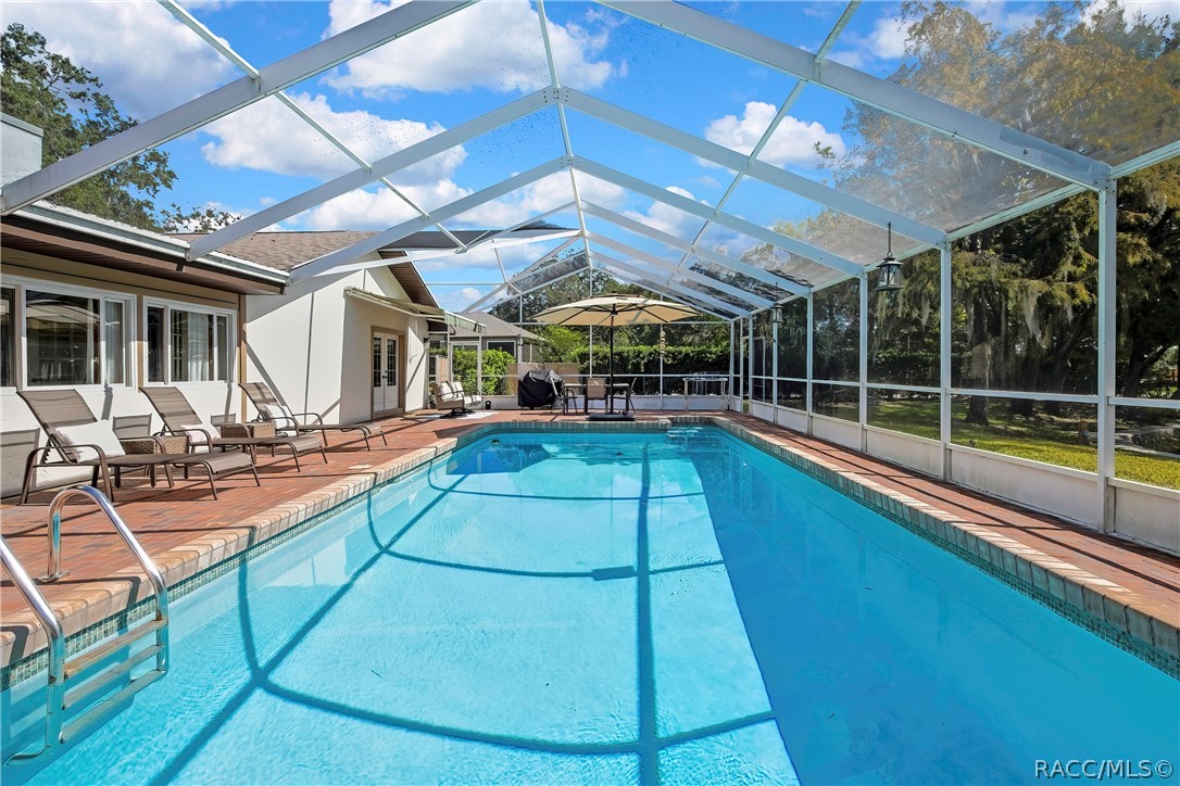 Full-length view of the screen-enclosed pool. Full-length view of the screen-enclosed pool.