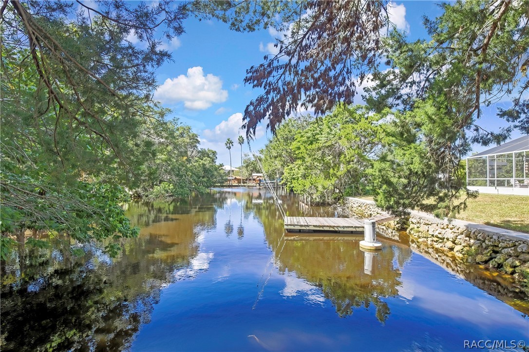 Canal frontage with tree-lined banks.