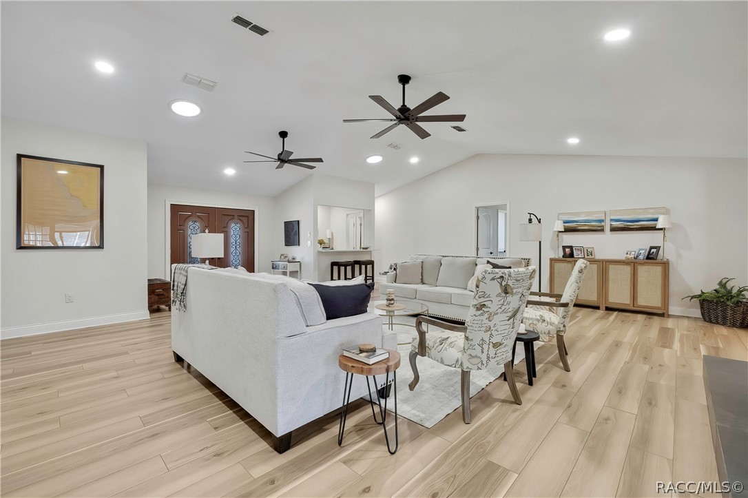 Open-concept living, dining, and kitchen area.