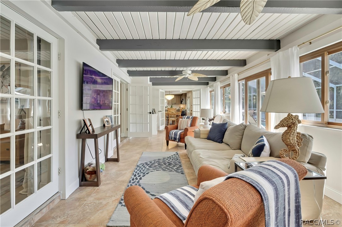 Family room seating area with wall-mounted TV