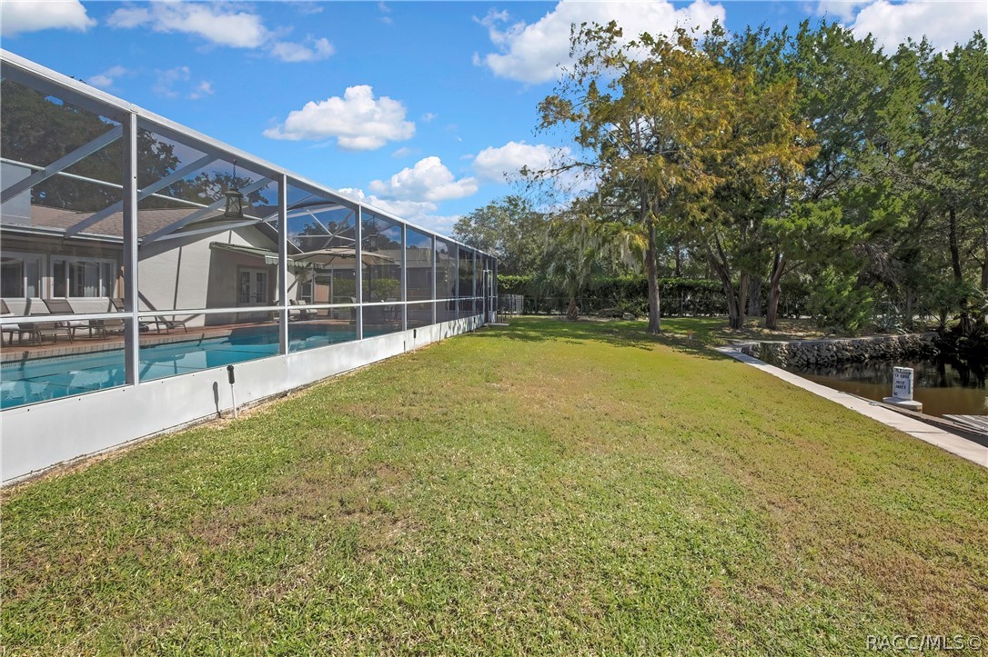 Side yard along the pool enclosure.