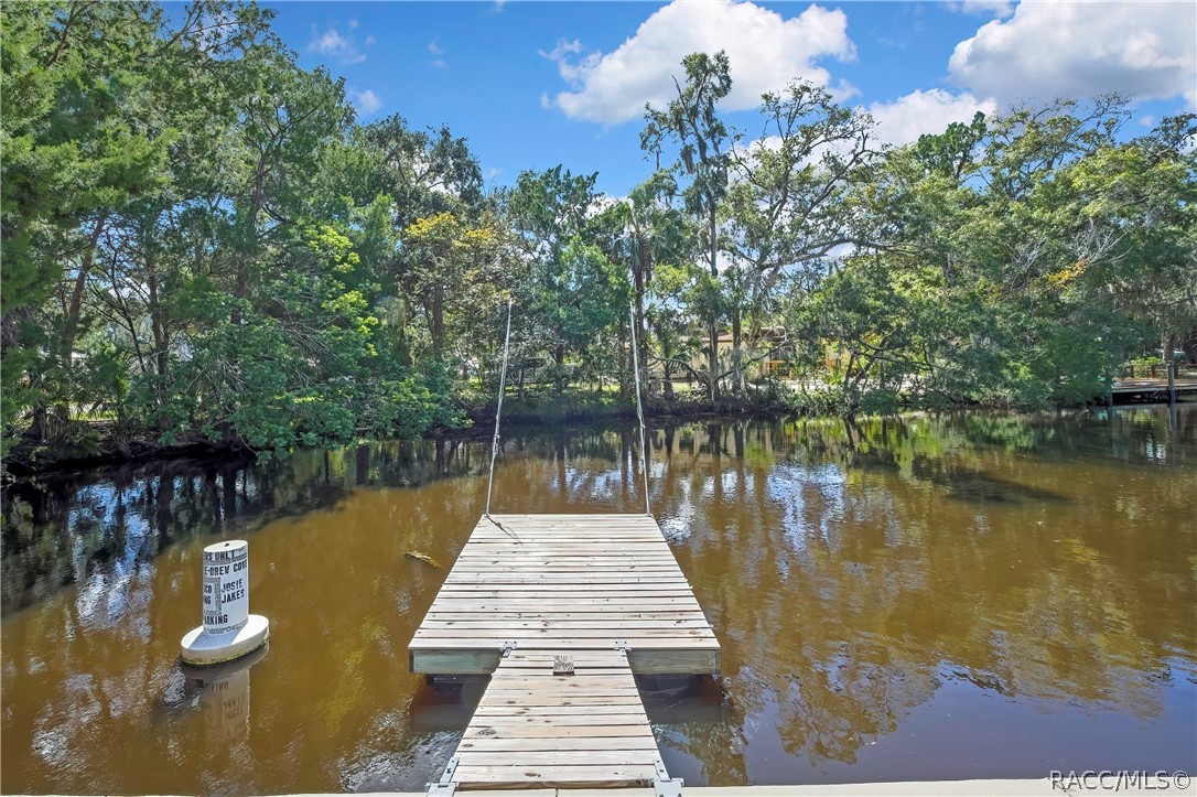 Wood dock extending into the canal.