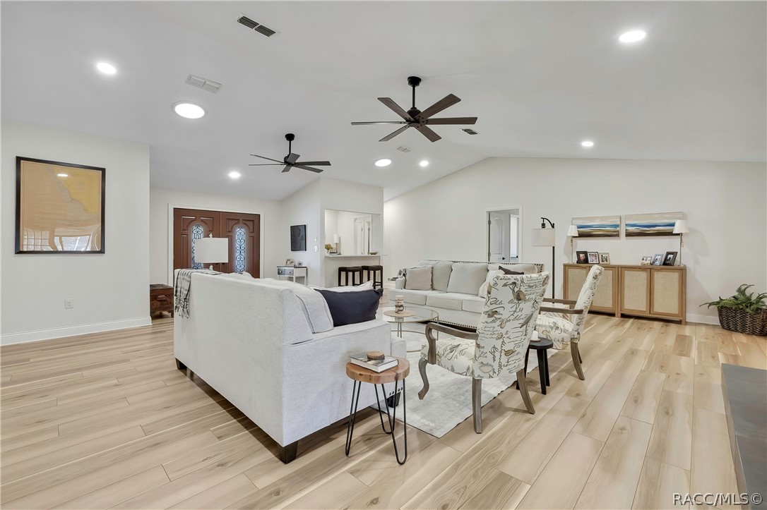 Open-concept living, dining, and kitchen area.