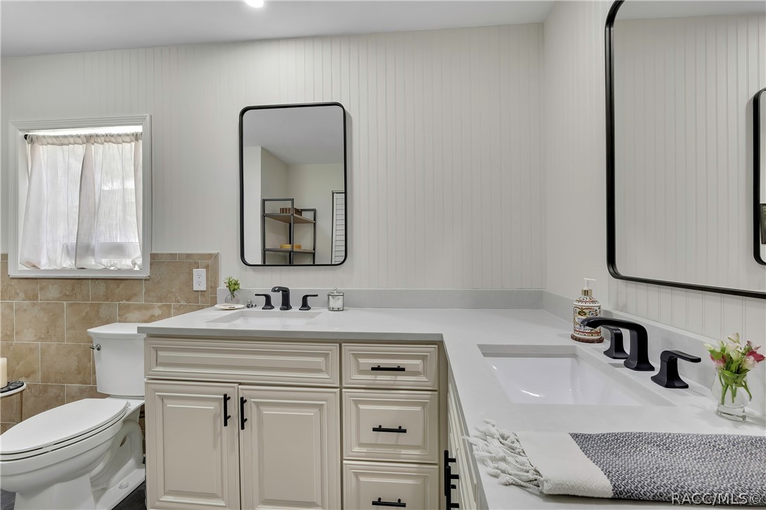 Bathroom with vanity, toilet