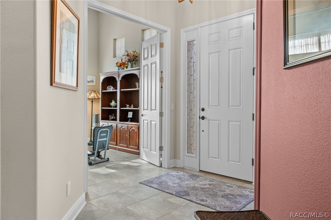 Stepping into the great room and looking back toward the entry door. The flex room, which could be a third bedroom is located right off of the foyer. Stepping into the great room and looking back toward the entry door. The flex room, which could be a third bedroom is located right off of the foyer.