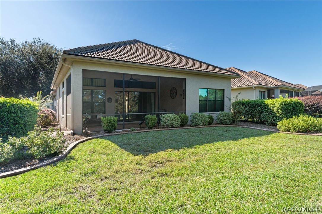 View from opposite side of the backyard accentuates the additional landscape and curbing, another upgraded feature the seller added.