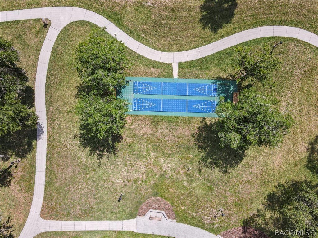 SHUFFLEBOARD COURTS
LET THE GOOD TIMES ROLL! Enjoy friendly competition on the community's TWO SHUFFLEBOARD COURTS, surrounded by green space, mature shade trees & scenic walking paths!