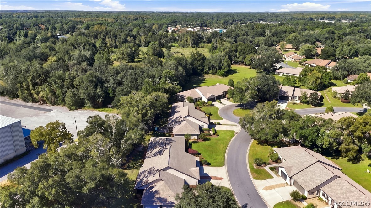 AERIAL VIEW OF COMMUNITY

Enjoy an aerial perspective of this established residential community, featuring winding streets, mature trees, attractive homes, and beautifully maintained green spaces.