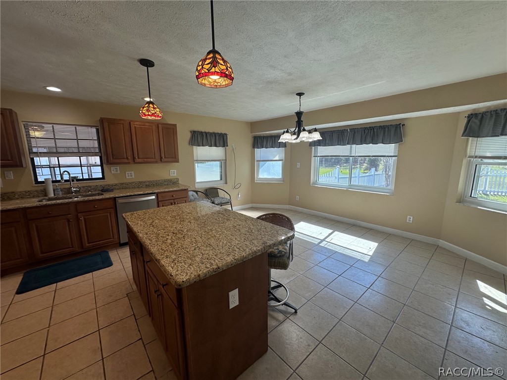 Island with bar seating and eat in kitchen space