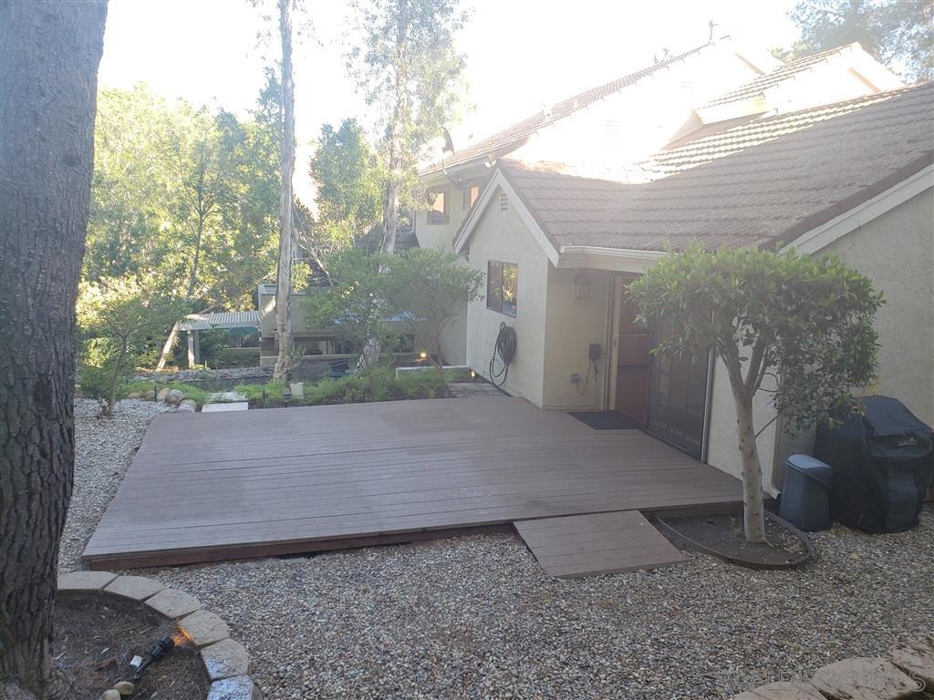 Plenty of trees and greenery makes this a quiet and peaceful back patio.