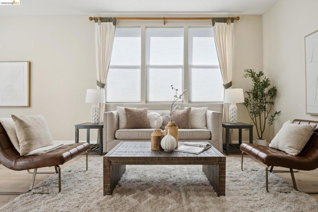 Triple-pane window assembly featuring natural light exposure and wood-finish flooring