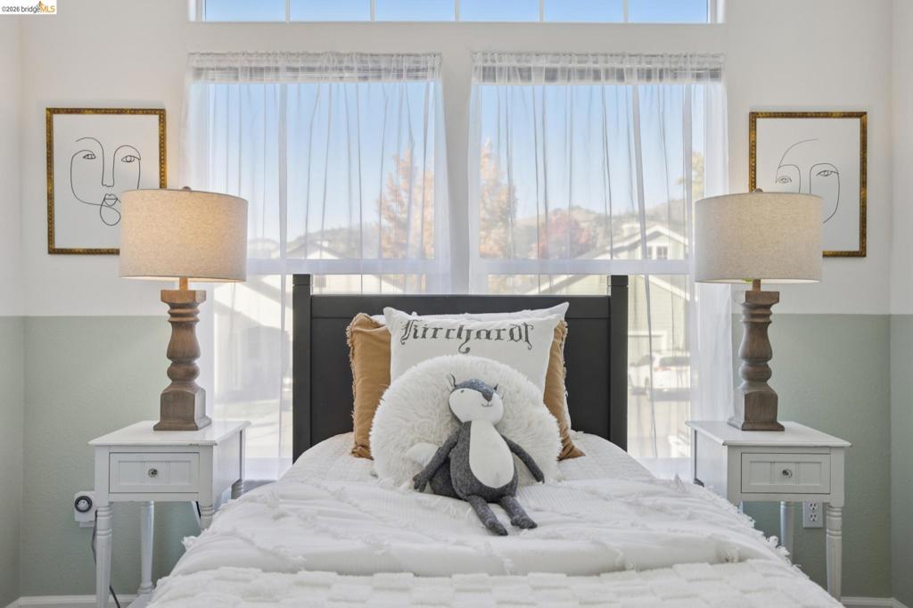 Dual windows with a rectangular transom, wall-to-wall paint detailing, and electrical outlets